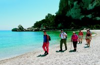 Walking on the sun drenched beaches of Sardinia