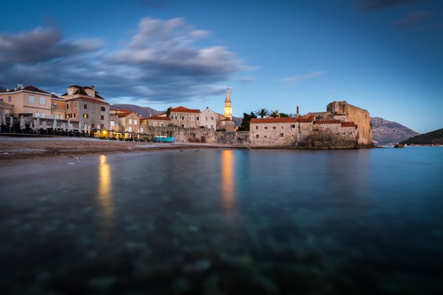 Budva’s old town and beach during sunset