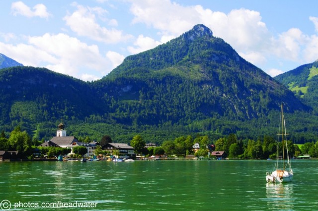 Lake side view of Strobl in rural Austria at the foot of a mountain